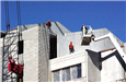Balcom's Cove Condominiums - February 22 2002 - working on top of building